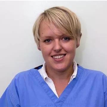 Smiling person in medical attire
