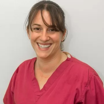 Smiling woman in scrubs